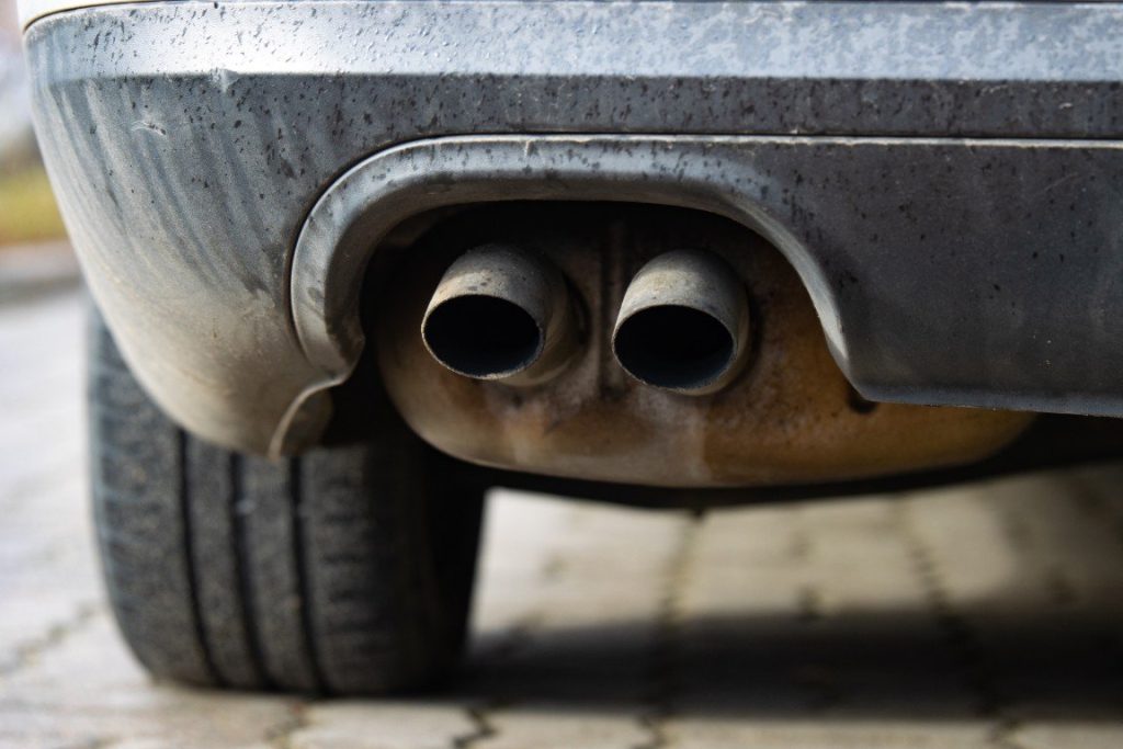 Dual exhaust tailpipes at the rear of a vehicle